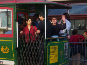 Woman waiving from trolley