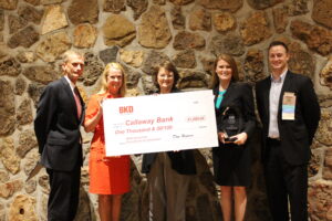 Kim Barnes, President & CEO of The Callaway Bank, accepts the award from BKD.