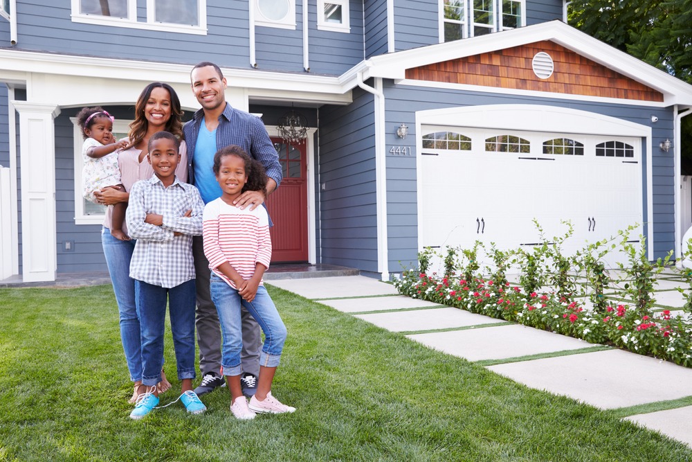 Family in front of house