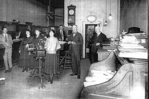 Inside bank behind teller line early 1900