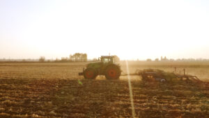 tractor working on large farm field 2021 09 04 04 17 12 utc scaled