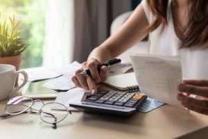 woman budgeting receipts for local banking