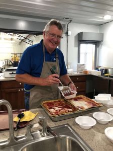 Agriculture lender serving food at local event in Mid-Missouri | Community Bank