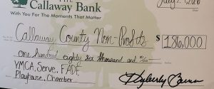 Check presentation for $186,000 donation to 5 area non-profits.