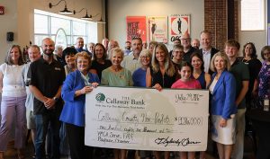 Check presentation for $186,000 donation to 5 area non-profits.