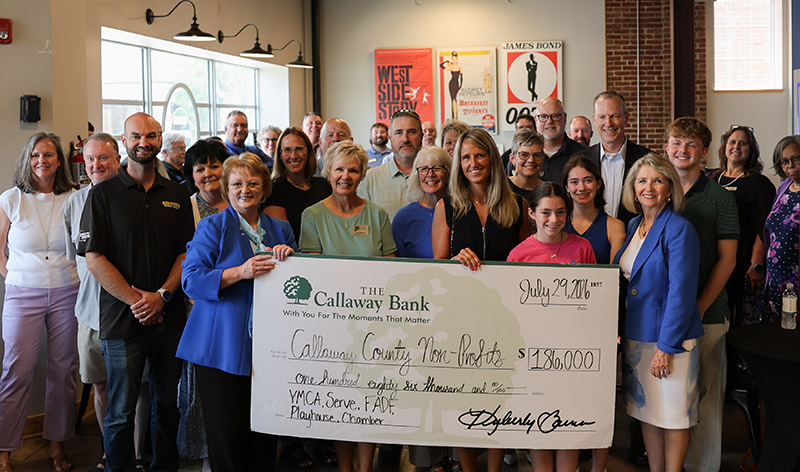 Check presentation for $186,000 donation to 5 area non-profits.
